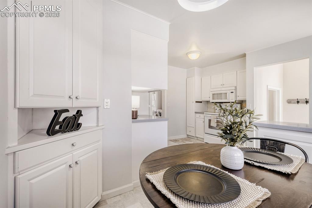 Image 10 of 34: Dining area with baseboards