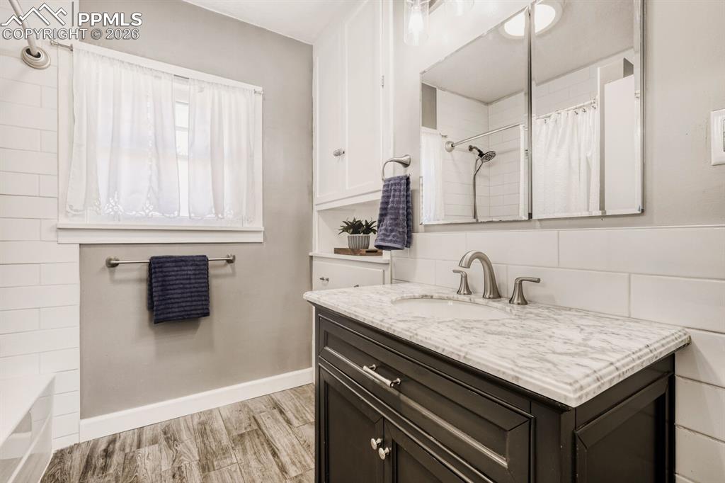 Image 17 of 34: Full bathroom featuring vanity and light wood-type flooring