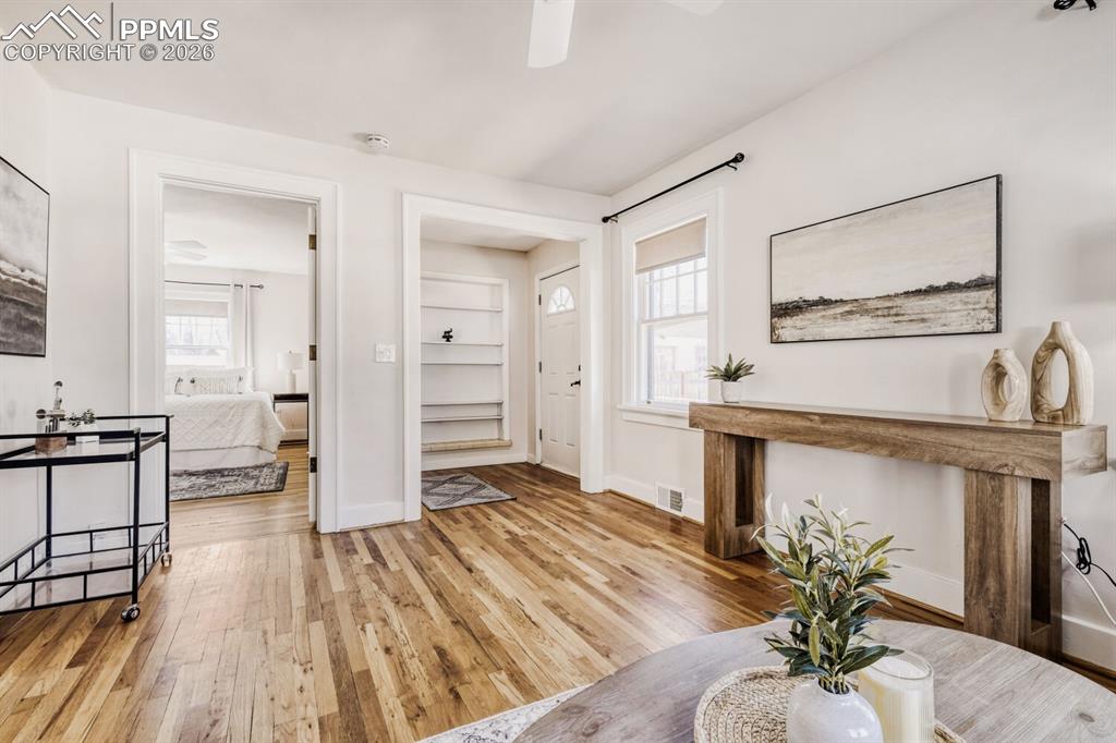 Image 6 of 34: Foyer with light wood-type flooring and ceiling fan