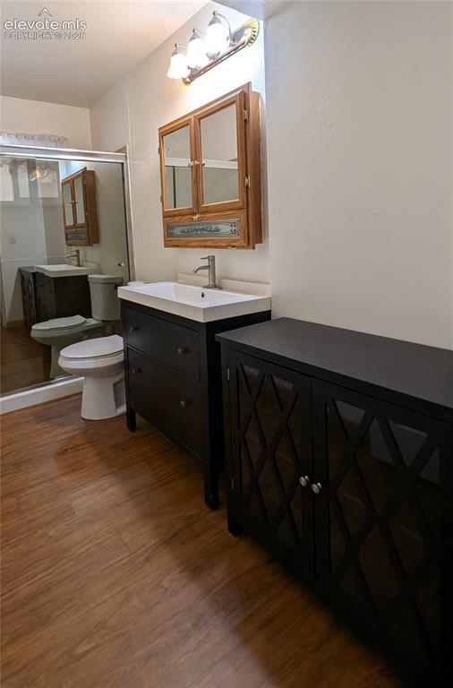 Image 7 of 16: Bathroom, walk-in shower, storage unit