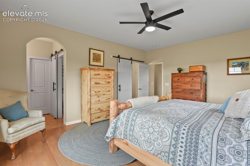 Image 15 of 45: Generous primary bedroom featuring dual en-suite baths, walk-in closet, and