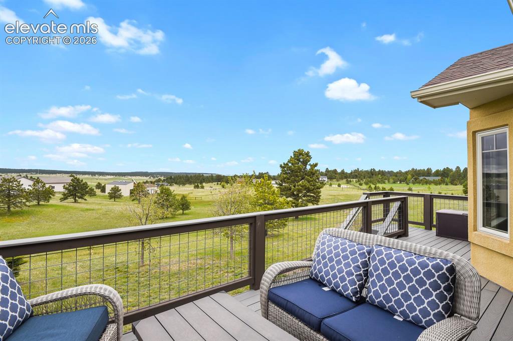Image 34 of 45: Elevated composite deck offers peaceful panoramic views and direct access f