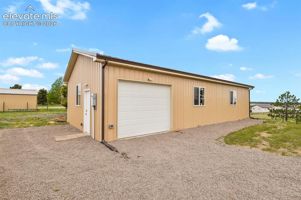 Image 37 of 45: Impressive 24x48 detached workshop provides exceptional space for hobbies, 