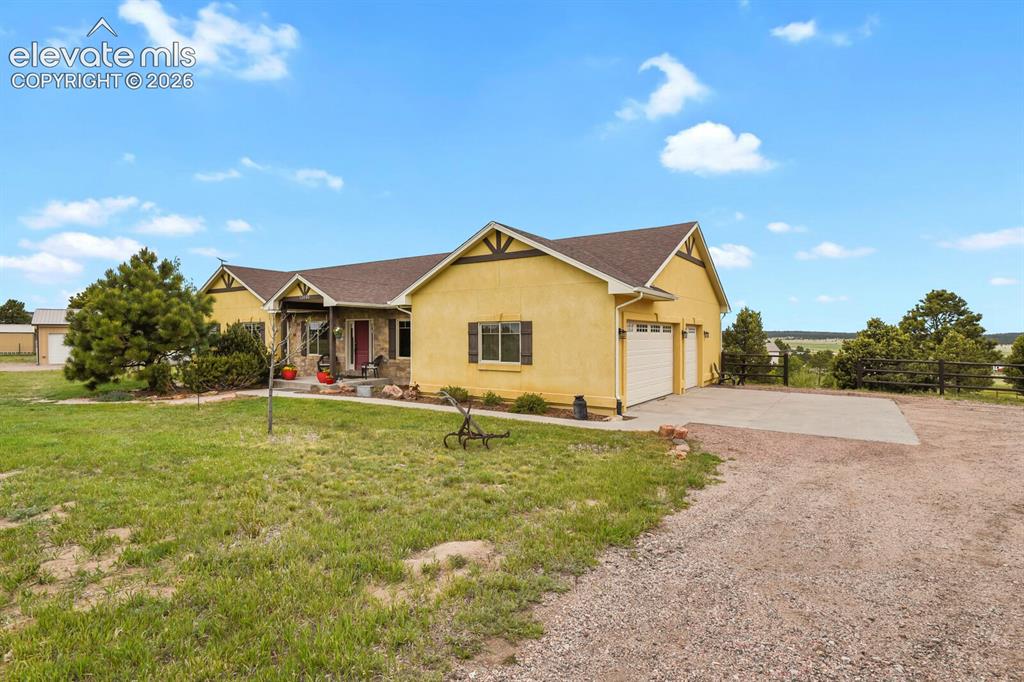 Image 4 of 45: Inviting front elevation with covered porch and welcoming curb appeal.