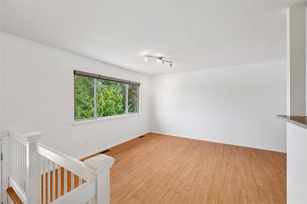 Image 10 of 33:  room featuring light wood-style floors and baseboards