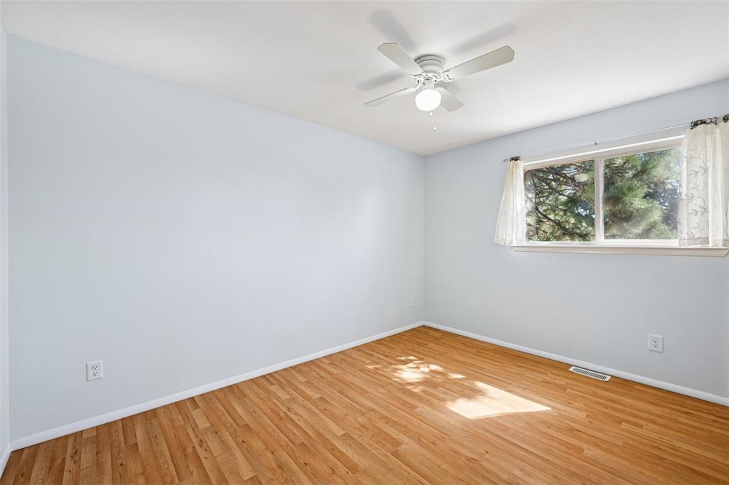 Image 15 of 33:  room with wood finished floors and ceiling fan