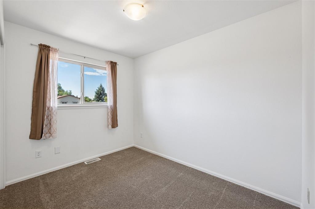 Image 19 of 33: Carpeted empty room featuring baseboards