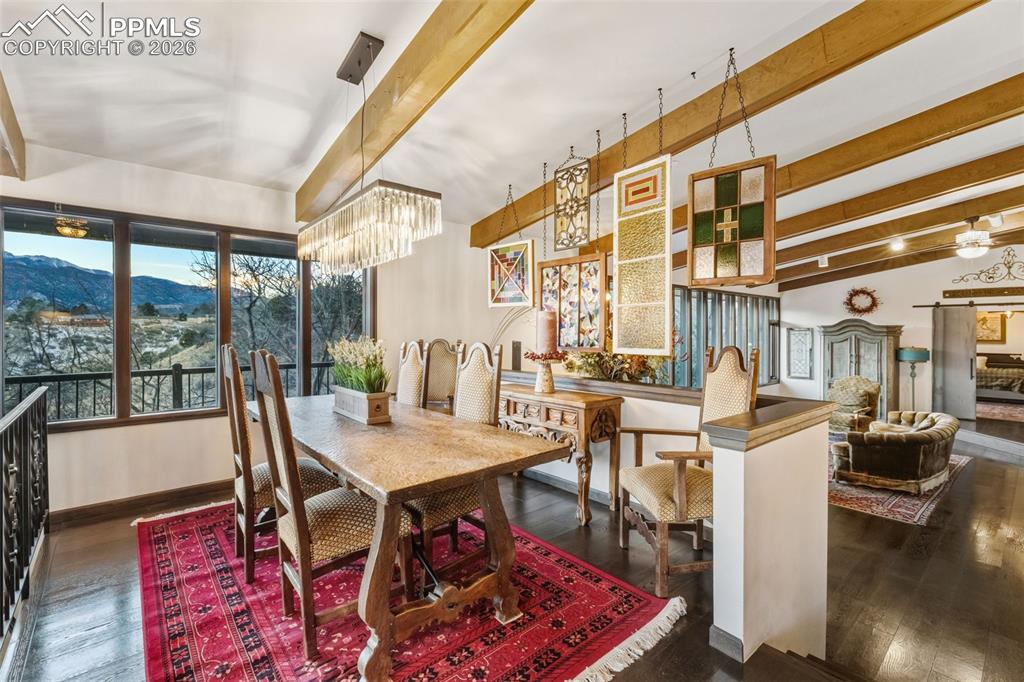 Image 11 of 46: Dining room off the kitchen, beautiful views with a wrap around patio. 