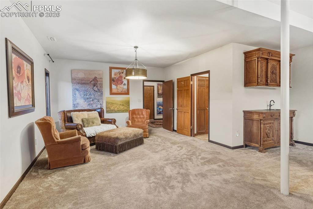 Image 31 of 46: Spacious basement family room. 