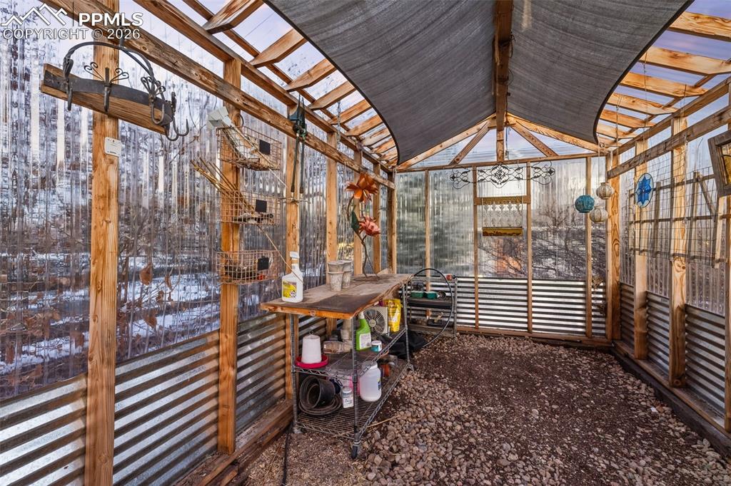 Image 37 of 46: Green house off the upper driveway. 