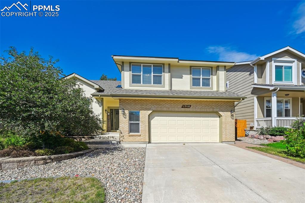 Image 2 of 39: View of front of house featuring brick siding, concrete driveway, an attach
