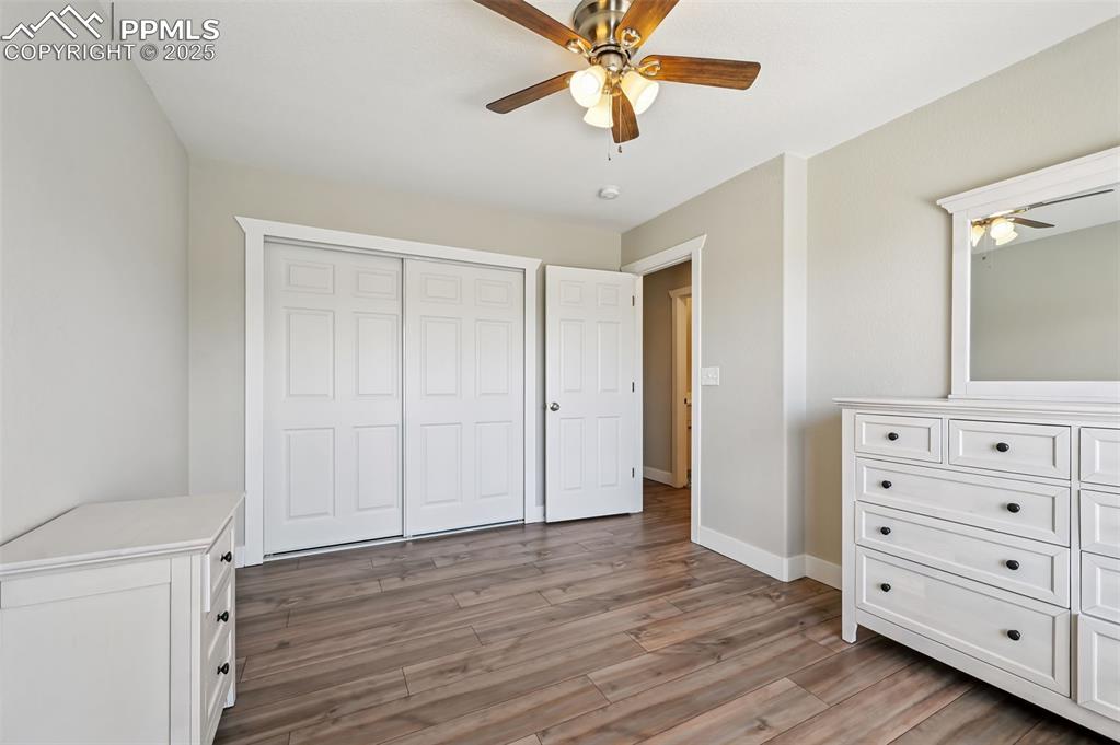 Image 25 of 39: Unfurnished bedroom featuring light wood-style flooring and ceiling fan