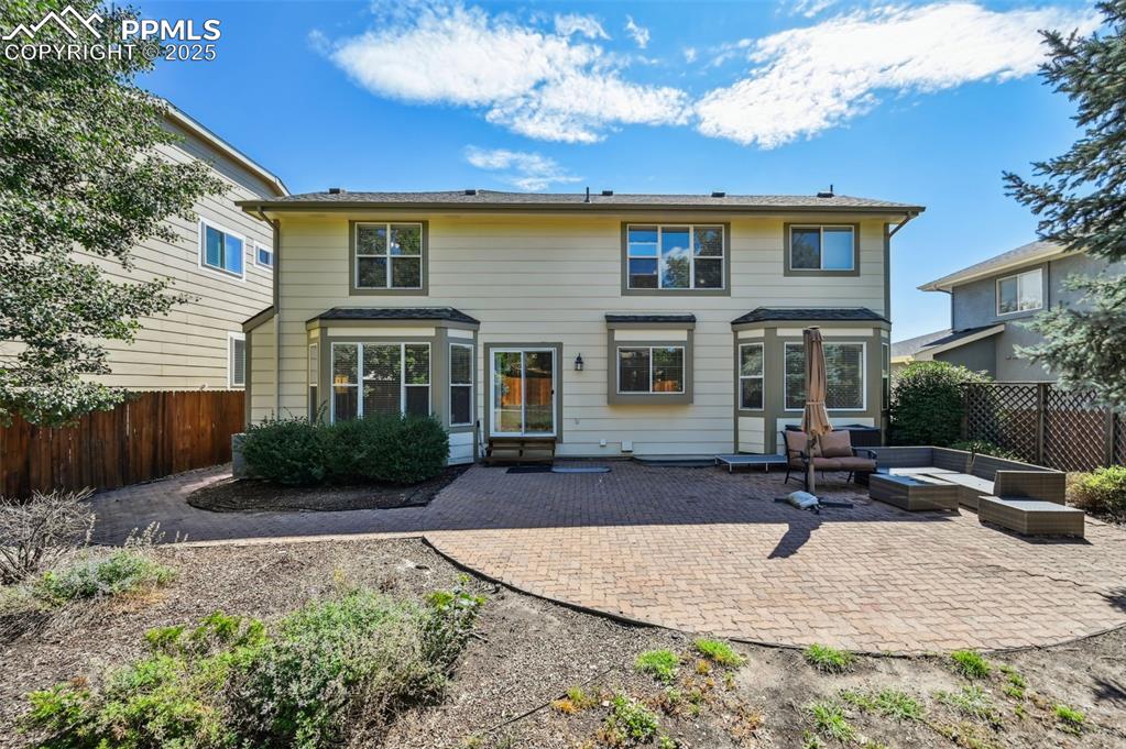 Image 36 of 39: Rear view of property with a patio and a fenced backyard