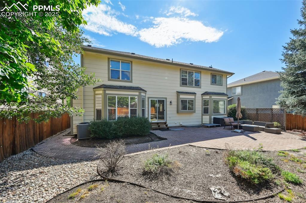 Image 38 of 39: Rear view of property with an outdoor hangout area and a patio area