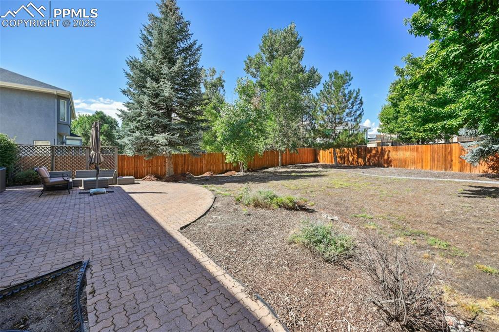 Image 39 of 39: Fenced backyard featuring a patio area