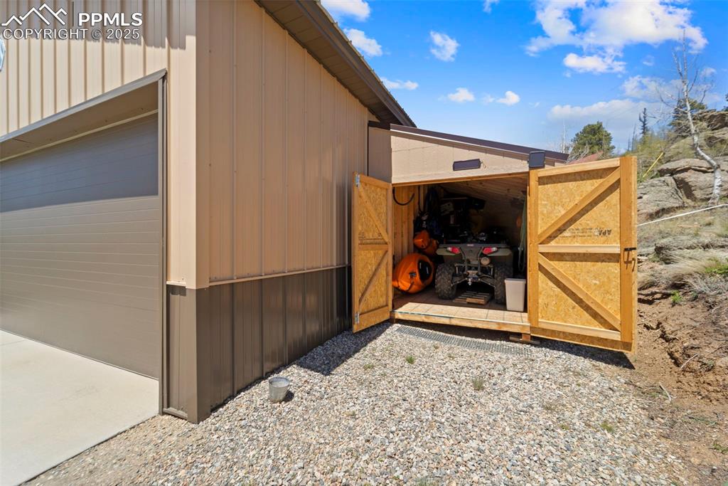 Image 20 of 31: Shed attached to side of the garage.