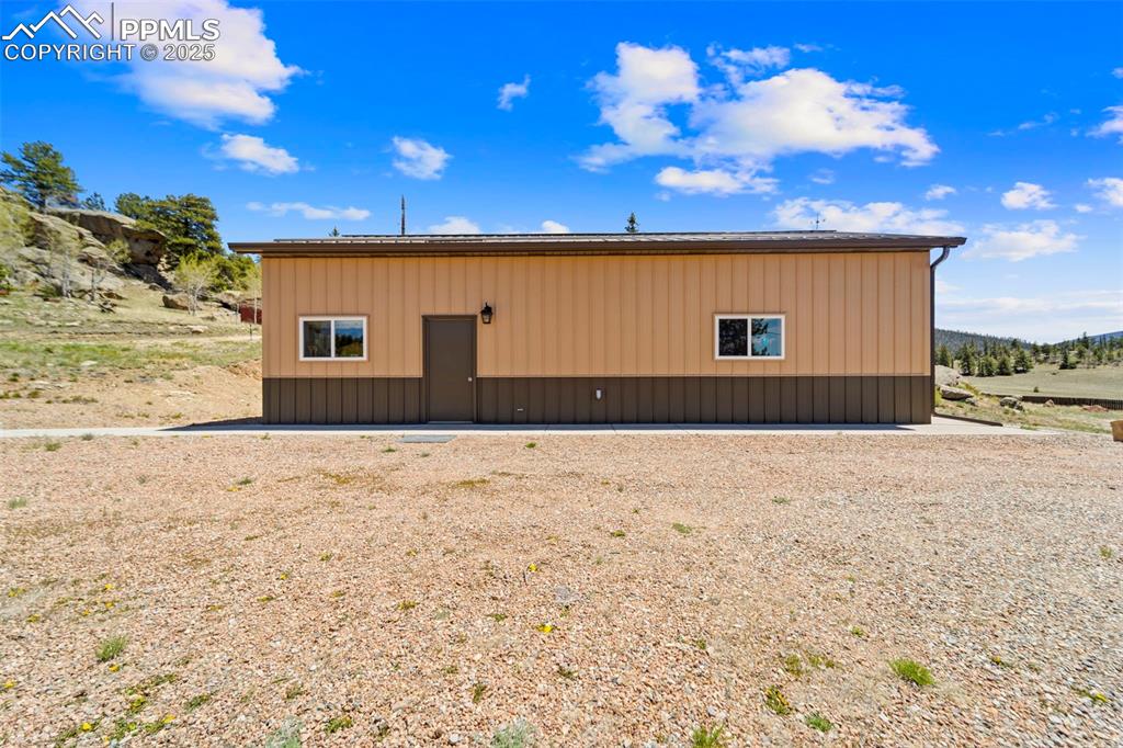 Image 21 of 31: View of property exterior with an outdoor structure