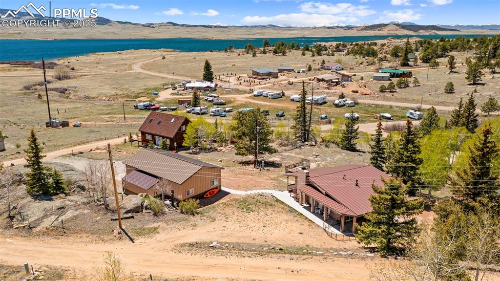 Image 27 of 31: View of subject property with a mountainous background