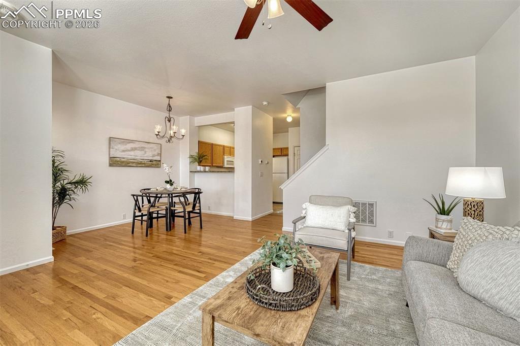 Image 11 of 30: Living Room looking toward Dining area and Kitchen