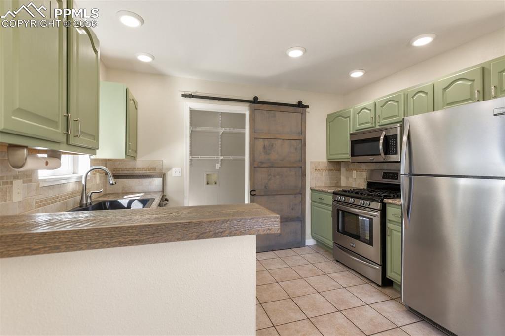 Image 10 of 34: Updated Kitchen and all Stainless Appliances included