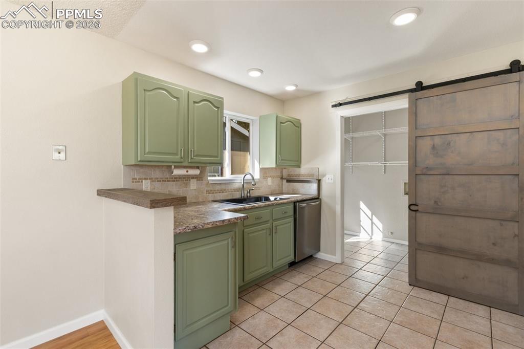 Image 11 of 34: Barn Door to close off Laundry Room