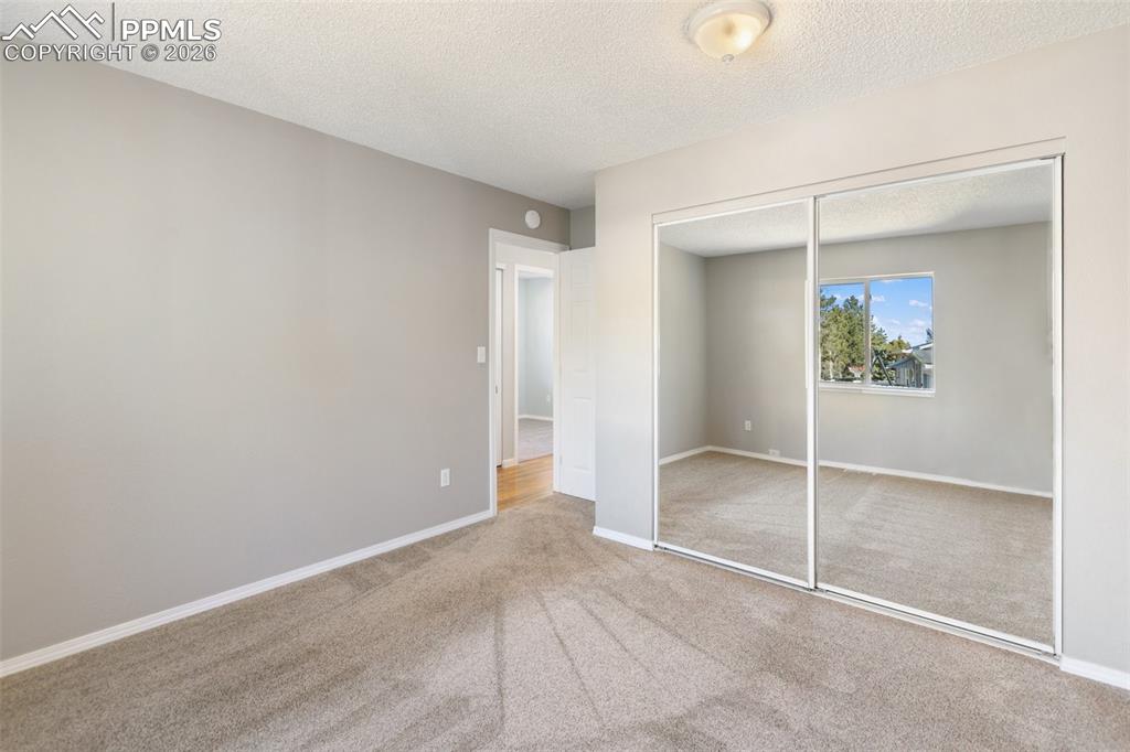 Image 18 of 34: Primary Bedroom with Extra Deep Closet with Organizers