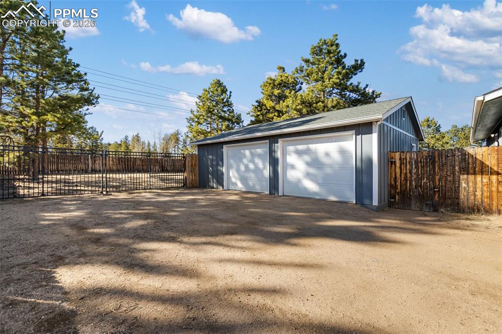 Image 2 of 34: Oversized Heated 2 1/2 Car Garage / Workshop with plenty of parking.  Even 