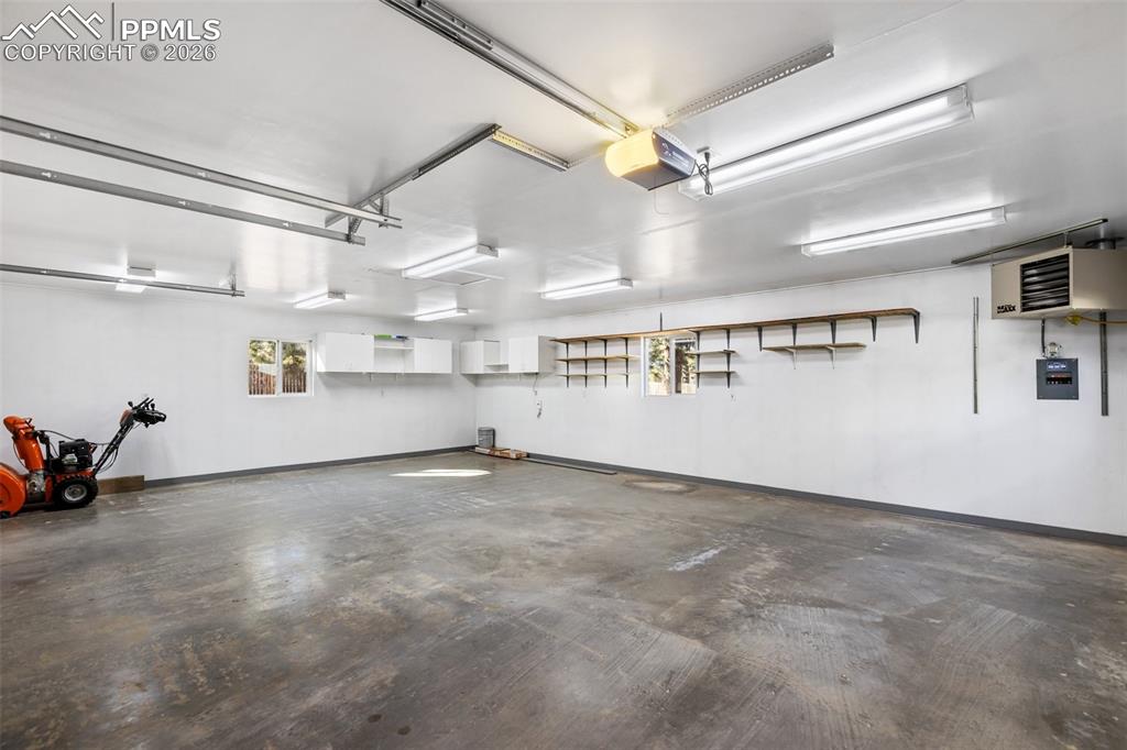 Image 27 of 34: Insulated, Drywalled and Heated!  This Garage/Workshop delivers.  220V too!