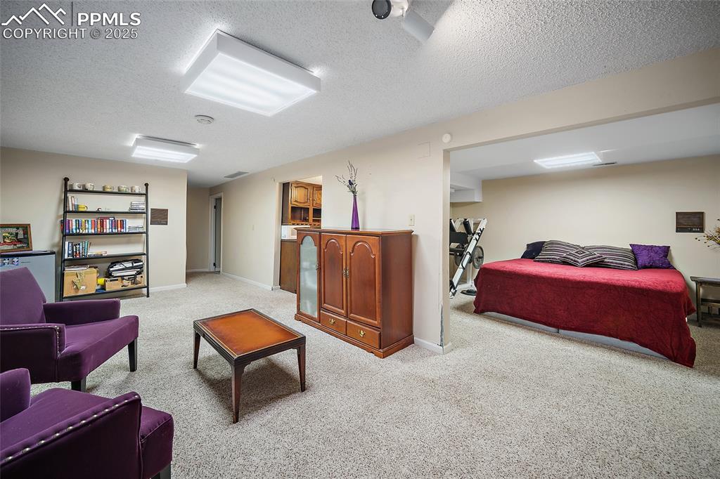 Image 30 of 50: Family room and easy to add a wall to make it a private bedroom.