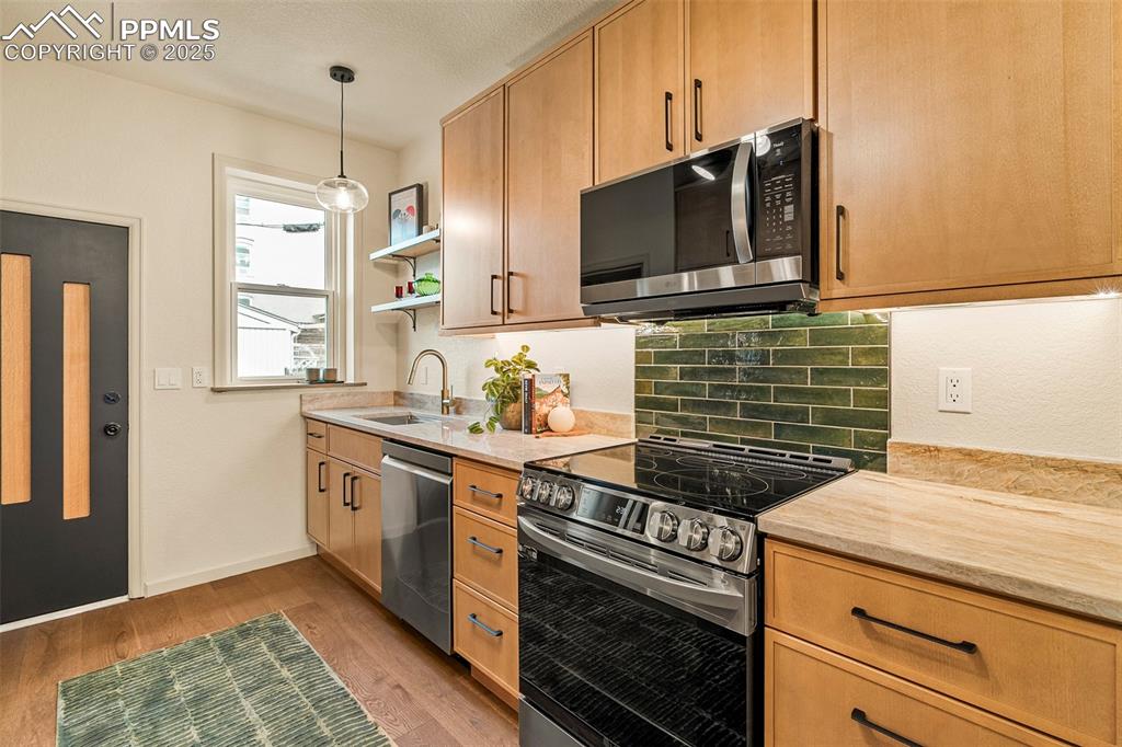 Image 12 of 47: The large custom kitchen has been completely remodeled, with tons of upper/