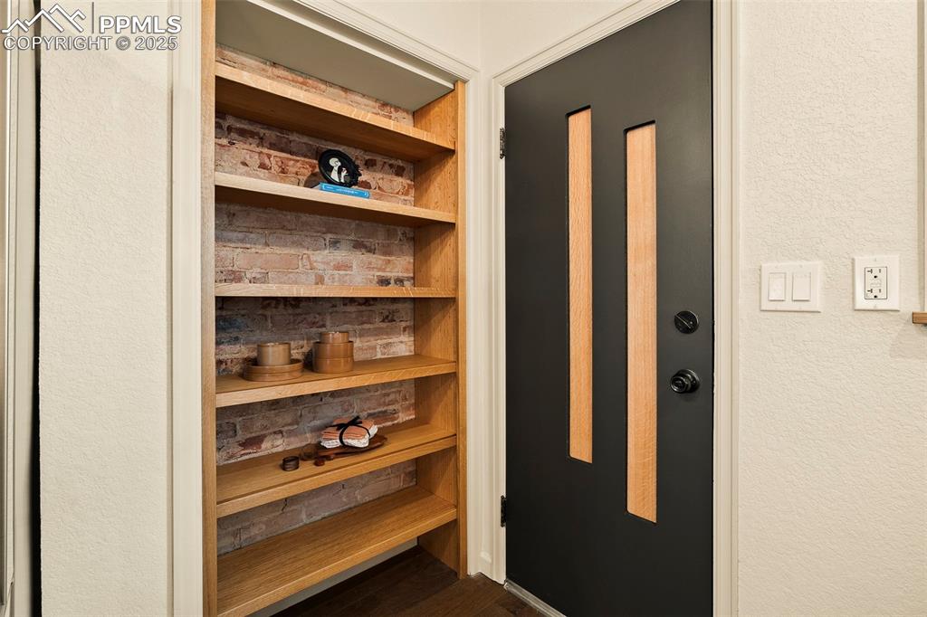 Image 18 of 47: Temporary wood panels in the back door have been replaced with transparent 
