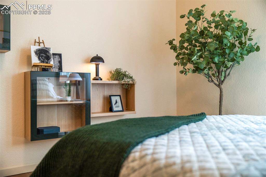 Image 23 of 47: Large front bedroom has beautiful natural light through a large front windo