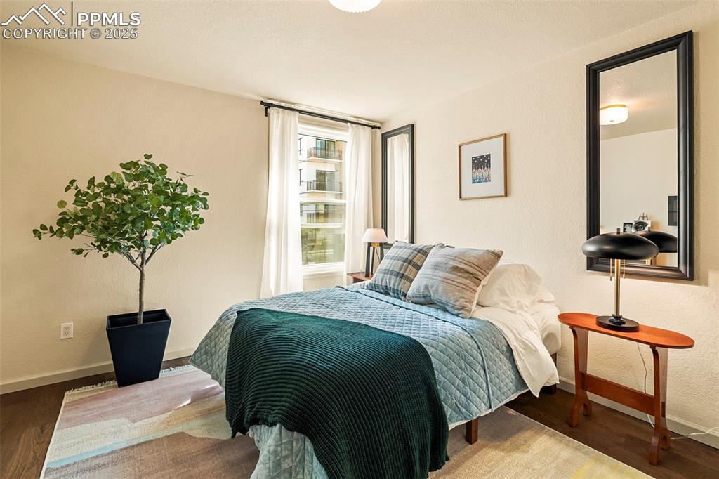 Image 24 of 47: Large front bedroom has beautiful natural light through a large front windo