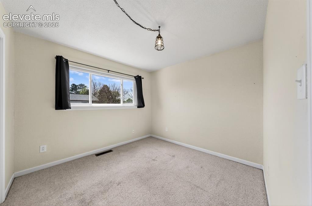 Image 16 of 25: Recessed window with white trim, light-colored walls, and neutral carpeting