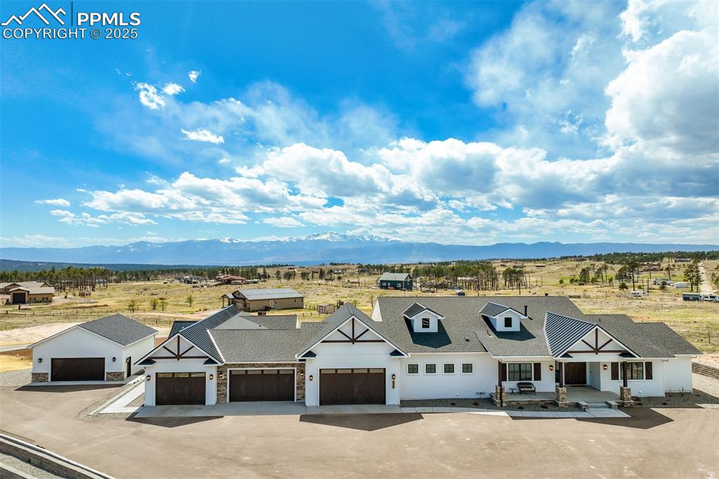 Caption: Custom home on 2.67 acres with attached 4 car garage, attached guest apartment with a one car garage
