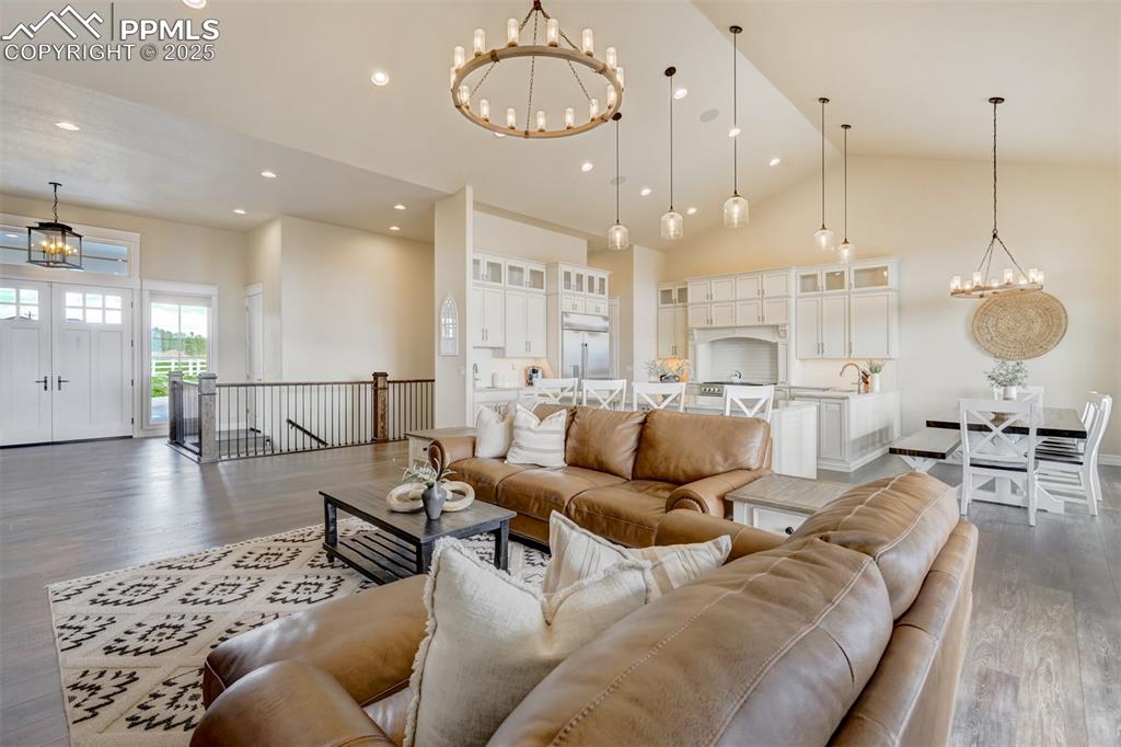 Image 2 of 50: Grand, main level with vaulted ceilings.