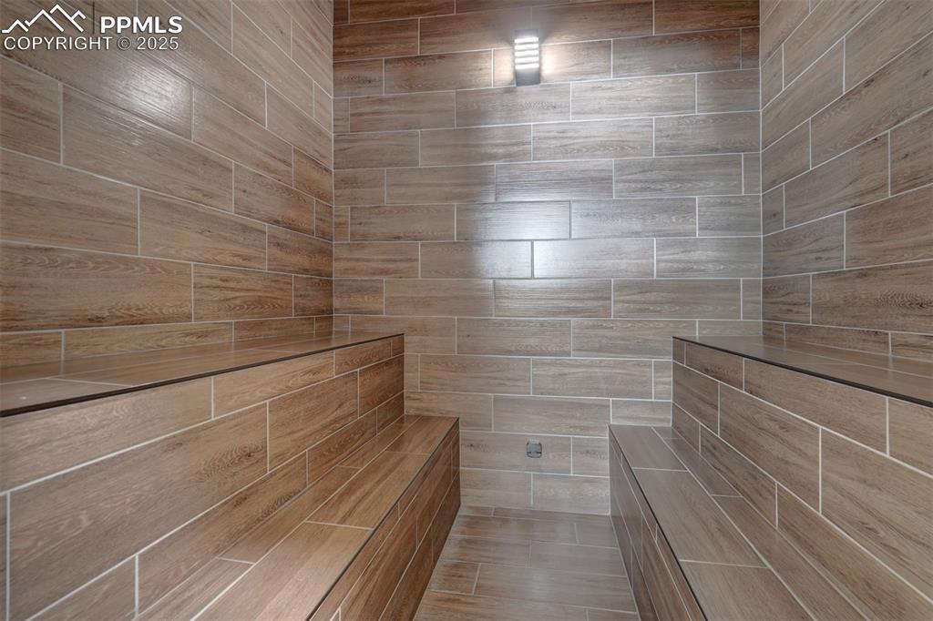 Image 32 of 50: Steam room in the gym.