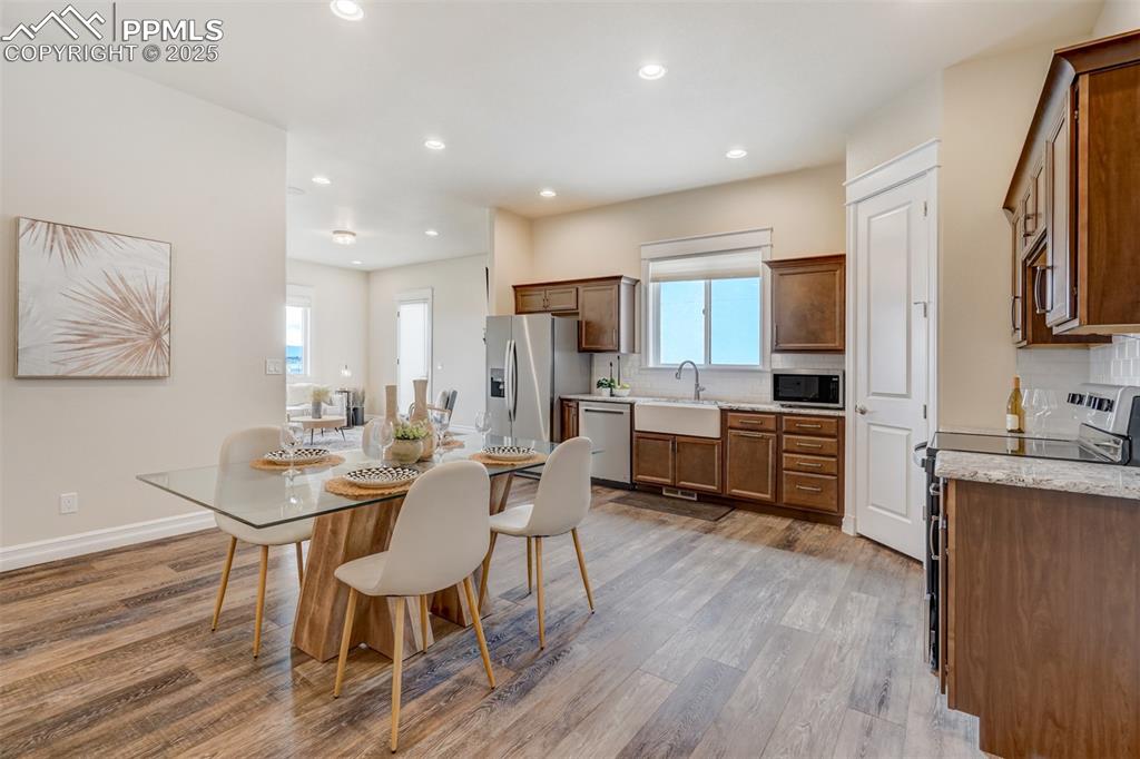 Image 42 of 50: Kitchen & Dining area in guest apartment.