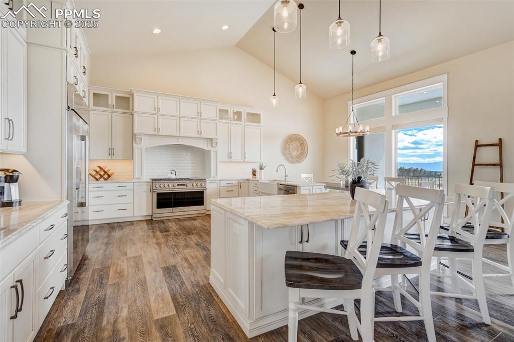 Image 5 of 50: This custom kitchen has space to host.