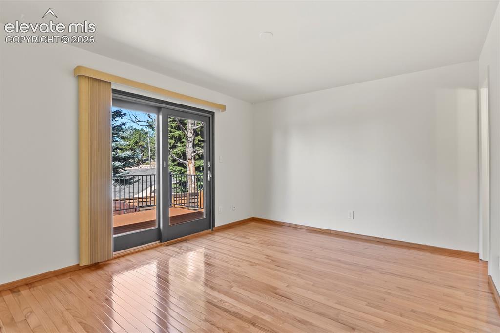 Image 15 of 50: Primary bedroom with walk out to new composite 30