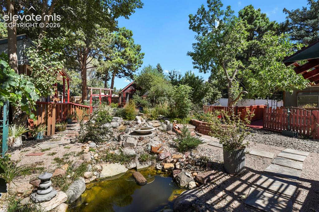Image 40 of 50: Pond area with beautiful trees, grape vines, 