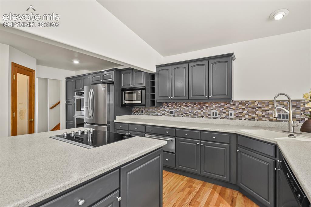 Image 8 of 50: New painted cabinetry & Corian counter tops