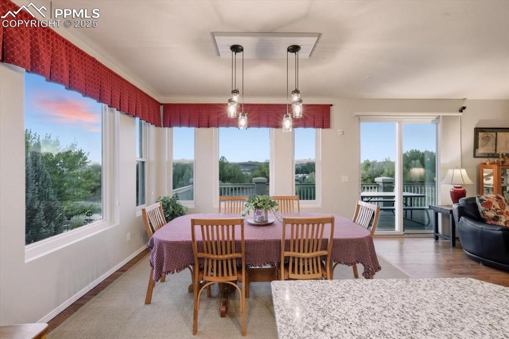 Image 10 of 26: Dining room featuring wood finished floors