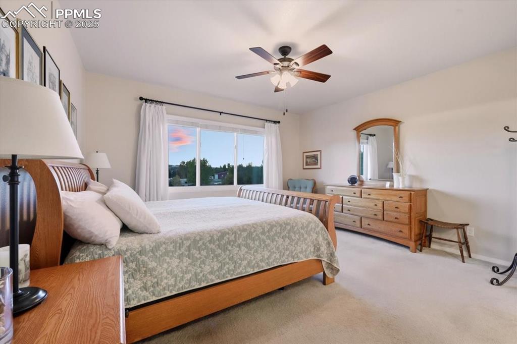 Image 13 of 26: Bedroom featuring carpet and ceiling fan & mountain views
