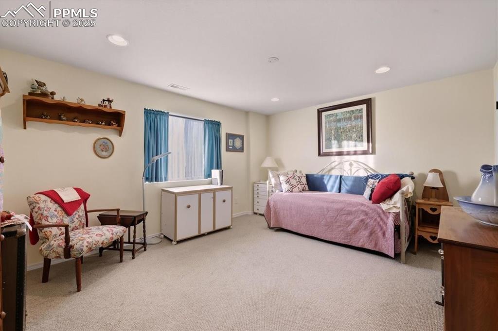 Image 16 of 26: Bedroom featuring light carpet and recessed lighting