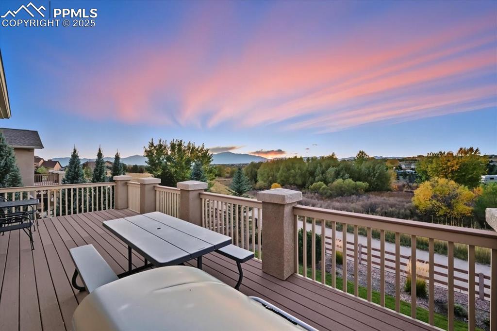 Image 2 of 26: Back Deck with Peak Views and backs to trail & open space