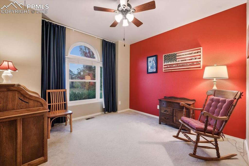 Image 5 of 26: Sitting room featuring carpet flooring and ceiling fan