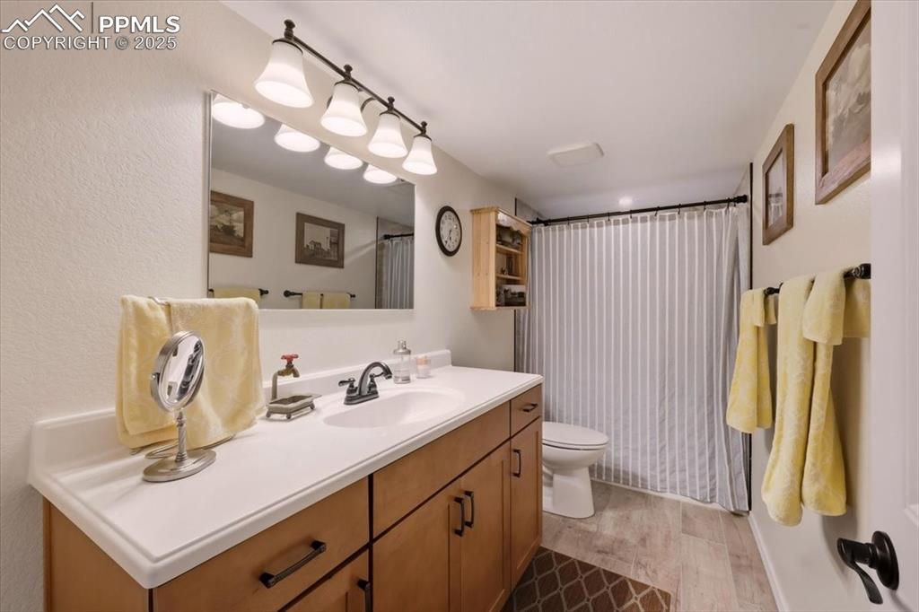 Image 6 of 26: Full guest Bathroom upstairs with vanity