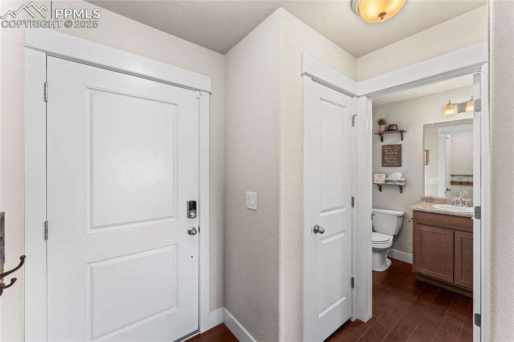 Image 17 of 33: Foyer with dark wood-type flooring