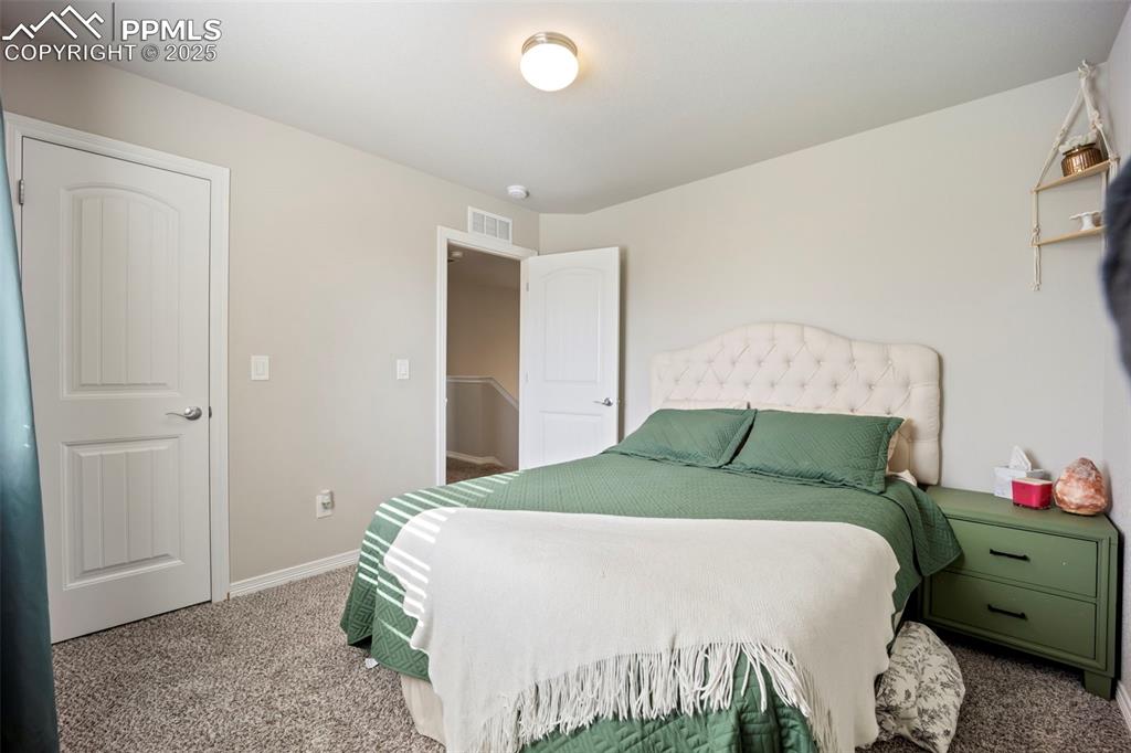 Image 13 of 45: Carpeted bedroom with baseboards